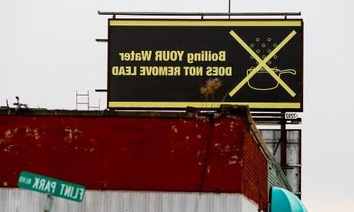 A billboard in Flint, Michigan, that reads "Boiling YOUR Water DOES NOT REMOVE LEAD"